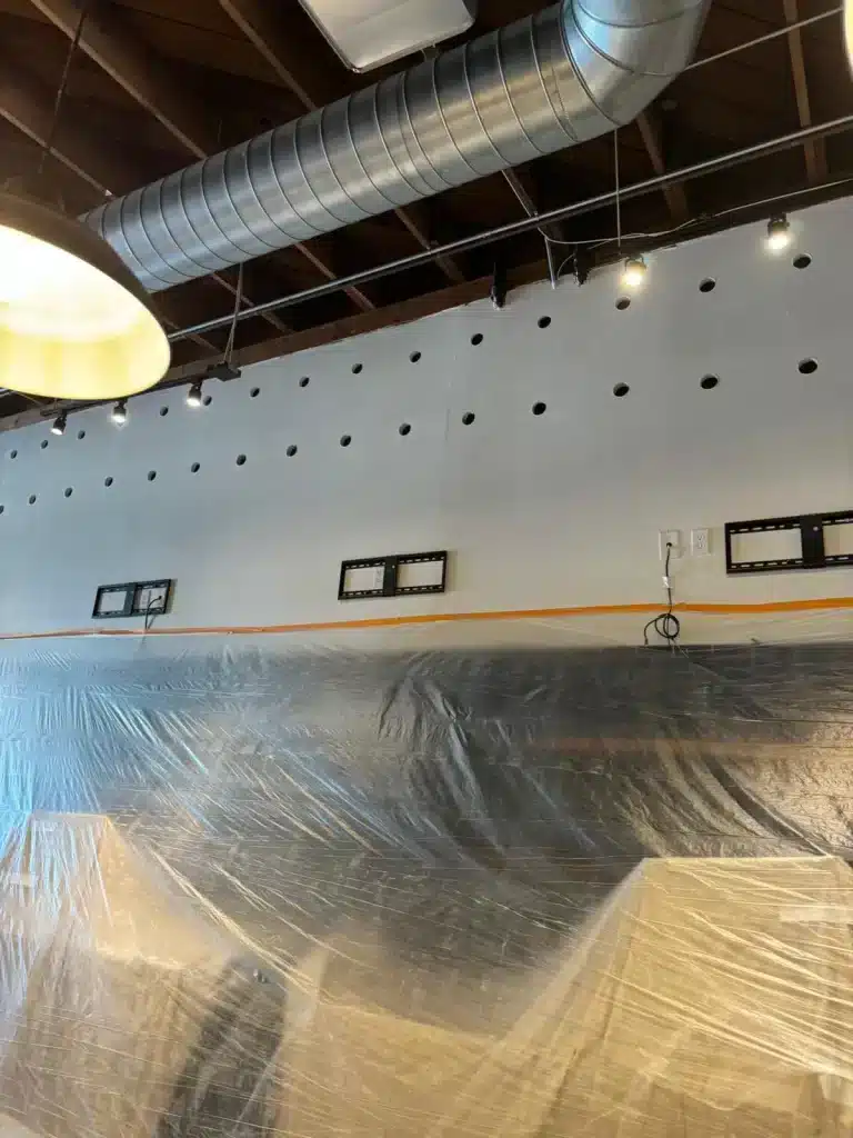 Professional commercial insulation installation in a large building, improving energy efficiency, temperature control, and overall performance.